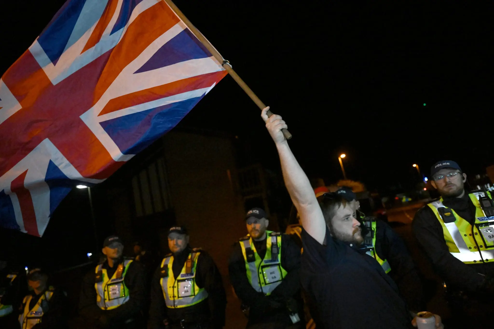 Police put English town on lockdown to quell anti-immigration protests